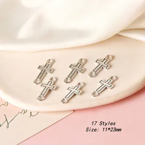 Macro detail of silver cross jewelry connectors, 11x23mm DIY earring charms with dual rings