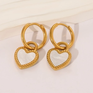 Elegant gold heart earrings with white mother of pearl inlay on white background