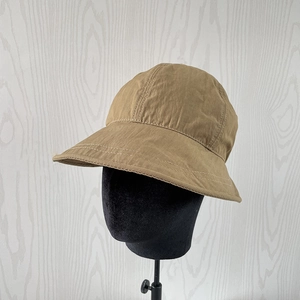 Detail of tan quick-dry nylon sun hat with reinforced double stitching on brim