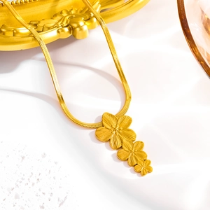 Golden five-petal flower pendant necklace with snake chain in a vintage palace style