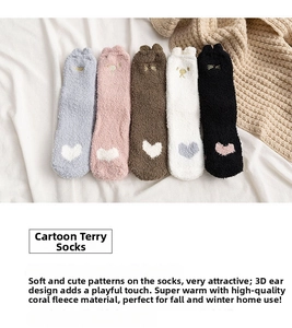 Detailed view of five pairs of warm coral fleece cartoon socks with 3D ears and hearts