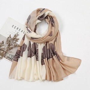 Bohemian style tassel scarf in cream and light coffee with leaf print pattern
