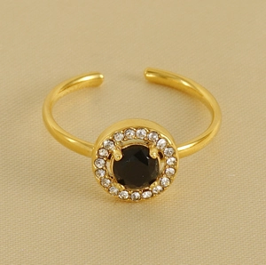 Detail of gold-plated open ring featuring a black gemstone with white zircon halo