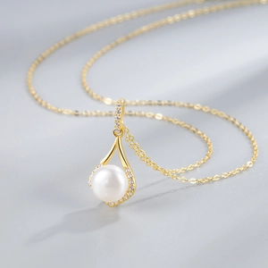 S925 sterling silver gold necklace featuring a teardrop pendant with a white pearl