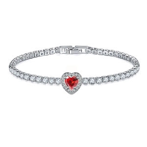Macro shot of silver tennis bracelet with a red heart-shaped gemstone and cubic zirconia