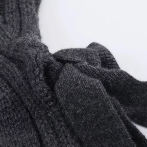 Women's autumn knitwear in dark grey with chunky knit texture and stylish knot design