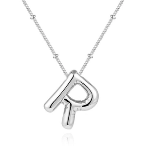 Detail of silver letter R balloon pendant with beaded chain on a white background
