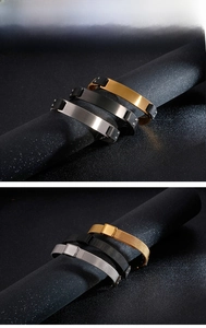 Detailed view of stainless steel ID mesh bracelets in gold, black, and silver finishes