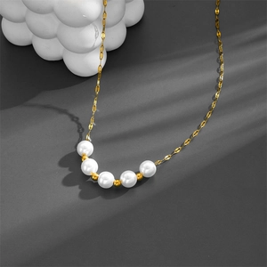 Elegant gold titanium steel choker necklace featuring five round white pearls on a grey background