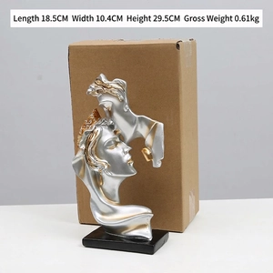 Abstract kissing sculpture ornament in silver and gold for modern home and office decor