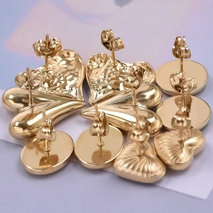 Detailed macro view of 304 stainless steel gold earring backs with butterfly stoppers