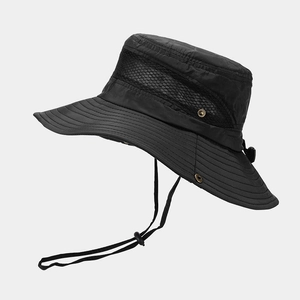 Detail view of breathable side mesh window and metal side buckle on black outdoor sun hat
