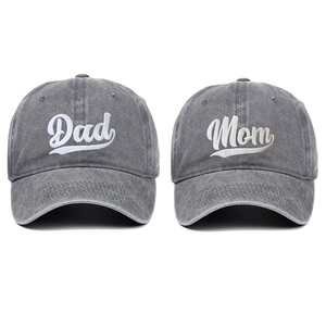 Detail of grey washed cotton baseball caps with Dad and Mom white 3D embroidery