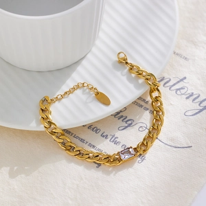 Detail of 18k gold plated Cuban chain bracelet with rectangular zircon and lobster clasp
