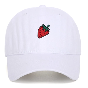 Close-up of red strawberry embroidery on a white washed cotton baseball cap texture