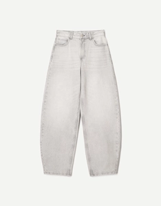 Detailed view of light gray high-waisted wide-leg jeans with washed denim texture