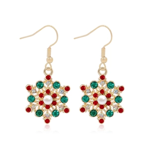Gold snowflake drop earrings with colorful rhinestones and pearl center on white background