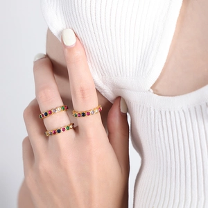 Stack of three gold-plated titanium rings with colorful inlaid crystal zircons for women