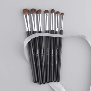 Detail of 7-piece pony hair eye shadow brush set with black matte handles and silver ferrules