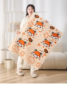 Asian woman holding a large vacuum storage bag with cute red panda prints in a living room