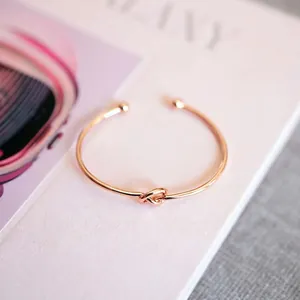 Elegant rose gold titanium steel knot open bangle for women with bead ends