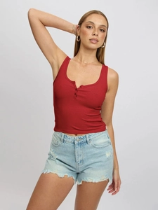Close-up of red ribbed knit Henley tank top with buttoned U-neckline detail