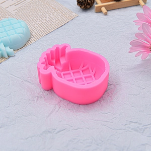 Pineapple shaped pink silicone cake mold with light blue finished sample for baking DIY