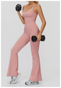 Detail view of pink yoga bodysuit with flare leg cut and sleek moisture-wicking fabric