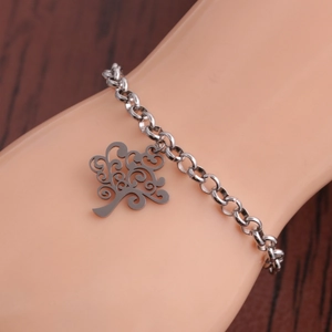 Silver stainless steel tree of life heart charm bracelet on a model wrist display