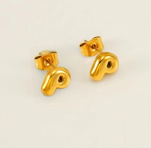 Detailed view of gold plated stainless steel letter P stud earring with smooth finish