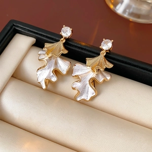 Elegant leaf-shaped drop earrings with white enamel finish and zircon studs in gold