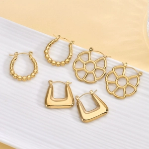 Three pairs of vintage 18K gold-plated stainless steel earrings with geometric designs