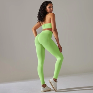 Side view of seamless ribbed neon green yoga set showing high waist leggings and sports bra