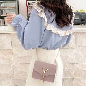 Chic lavender quilted bag with golden deer head tassel and metal chain detail