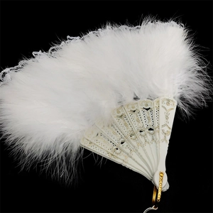 Elegant white feather hand fan with ornate gold patterned handle on black background