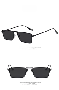Detail view of square black metal frame sunglasses with dark grey resin lenses