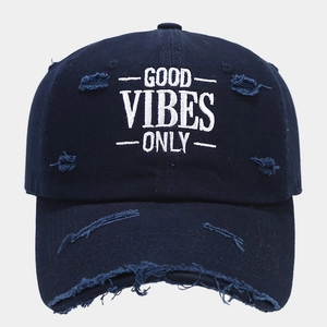 Detail of Good Vibes Only embroidery on navy blue distressed vintage baseball cap