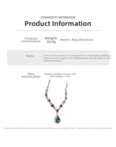 Detailed view of rhinestone necklace with green drop pendant and floral accents