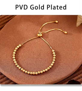 Detail view of gold PVD plated bead bracelet with adjustable slide clasp mechanism