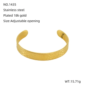 Irregular textured C-shaped 18k gold plated stainless steel open bangle with beaded edges