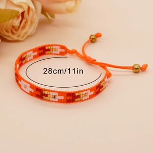 Handgefertigtes Boho-Perlenarmband in Orange und Gold mit verstellbarer 28 cm Kordel für Damen