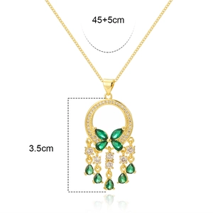 Detail of gold emerald necklace with teardrop zircon tassel and size dimensions
