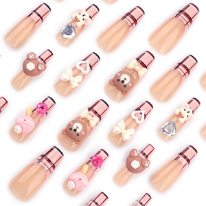 Press-on nails set with brown cartoon bear, red plaid patterns, and 3D bow decorations