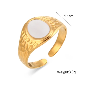 Detail of 18K gold-plated ring with white oval inlay and hammered texture, 1.1cm wide