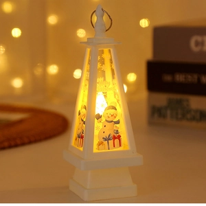 Detail of white pyramid LED Christmas lantern with snowman motif and warm yellow light