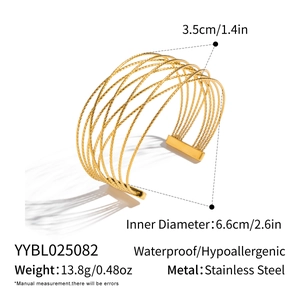 Detail view of a 3.5cm wide gold hollow stainless steel mesh bangle with size specs