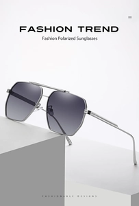 Close-up of polarized pilot sunglasses with silver metal frame and gray gradient lenses