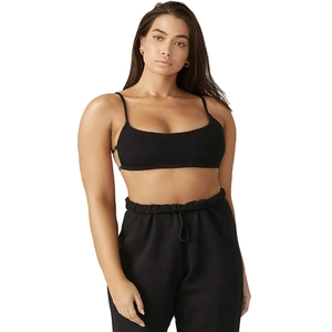 Detailed texture of black slim fit crop top and matching high waist leggings set
