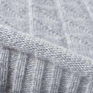 Women's grey wool knit beanie featuring geometric diamond patterns and ribbed cuff details