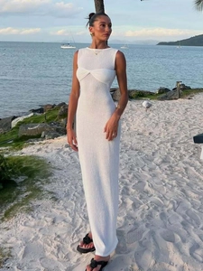 Elegant white sleeveless knitted maxi dress perfect for summer beach vacations and leisure